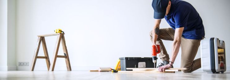 A Handyman Doing Carpentry Work inside Home