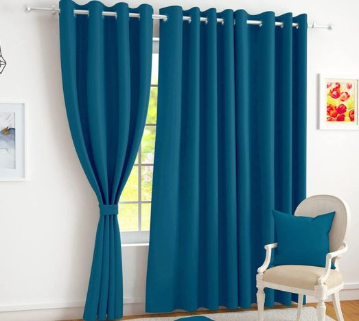 Dark Green Curtain On Window With Chair In Front