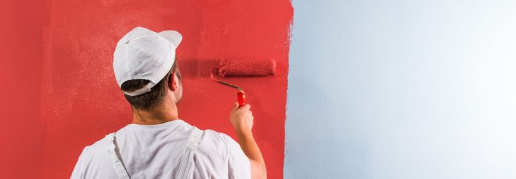 Painter Painting Dark Red Color on Interior Wall